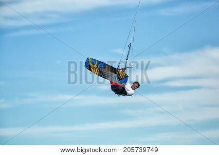 January 25 2014 Los Barriles Mexico: kiteboarder lifts off from water and leaps in air at the 'Lord of the Wind' kite surf competition