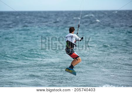 January 25 2014 Los Barriles Mexico: kiteboarder lifts off from water at the 'Lord of the Wind' kite surf competition