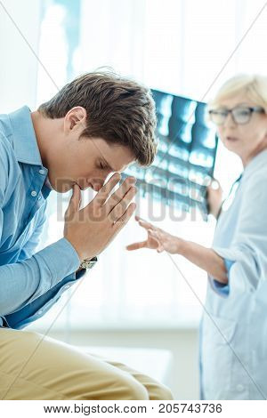 Young Man Dissapointed By Diagnosis