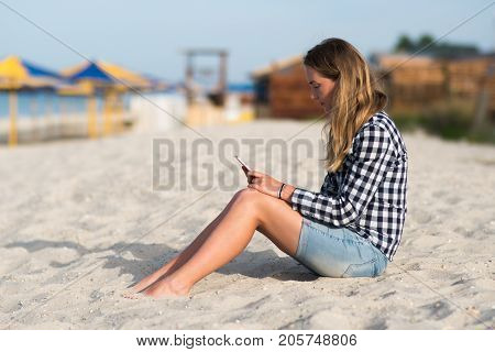 Beautiful girl holding a smartphone in the hands of a green screen green screen, hand of man holding mobile smart phone with chroma key green screen on white background, new technology concept