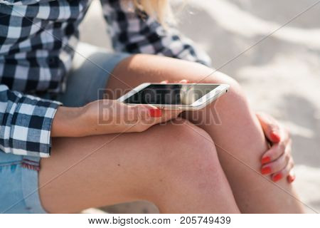 Beautiful girl holding a smartphone in the hands of a green screen green screen, hand of man holding mobile smart phone with chroma key green screen on white background, new technology concept