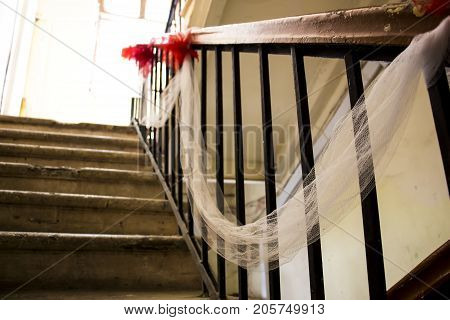 Handrail decorated with red bows for festive events
