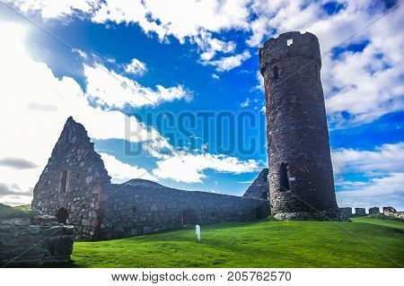 Peel Castle's tower next to Saint Patrick's Church constructed by vikings at Peel city in Isle of Man