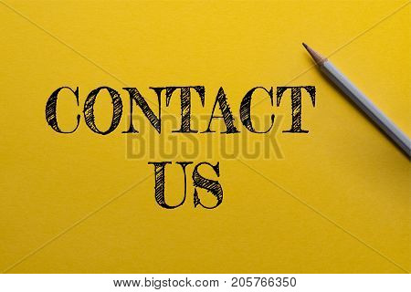 Yellow paper with pencil and text 