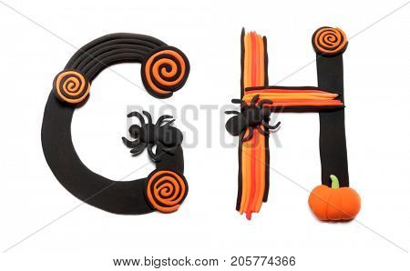 Plasticine letters G and H. Halloween alphabet. Made in modeling techniques from plasticine