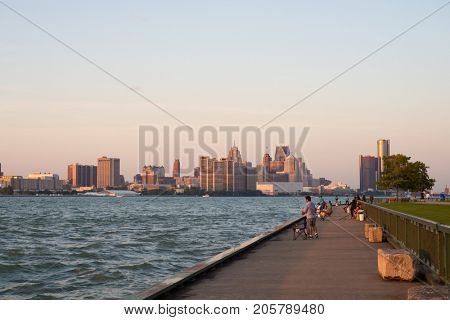 WINDSOR, ONTARIO - SEPT 2, 2017: Panoramic view of Windsor's waterfront with downtown Detroit skyline and the General Motors Renaissance Center in the background.