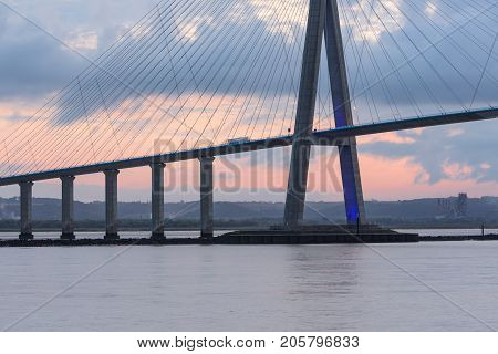 Sunrise view at Pont de Normandie bridge over river Seine between Le Havre and Honfleur in France