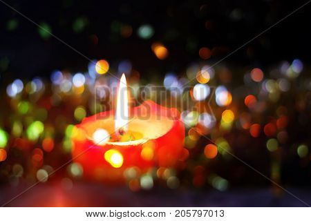 Burning Candle On Christmas Decoration Background. Festive Composition.