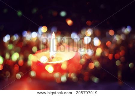 Burning Candle On Christmas Decoration Background. Festive Composition.