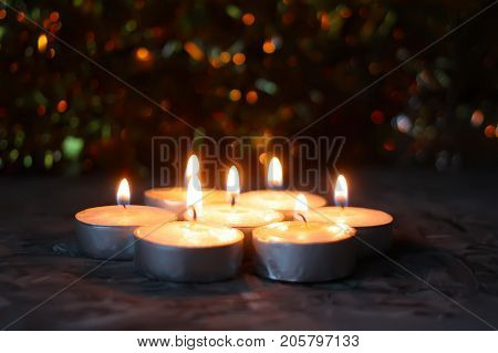 Burning Candles On Christmas Decoration Background. Festive Composition.