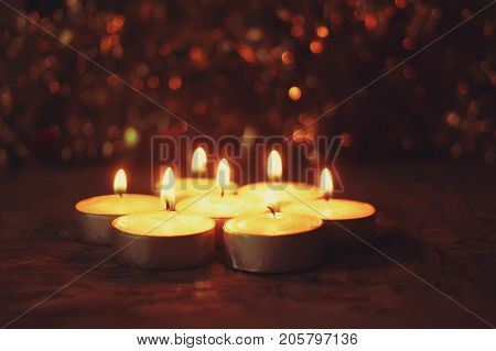 Burning Candles On Christmas Decoration Background. Festive Composition.