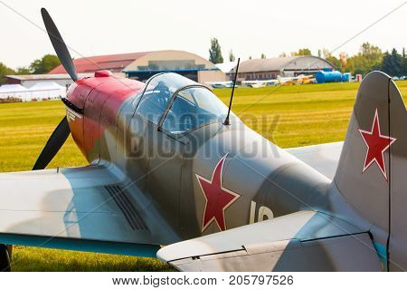 PRAGUE, CZECH REPUBLIC - 9.09.2017: Propeller military plane yak 52 parking at the airport in sunny day, Prague, Czech Republic