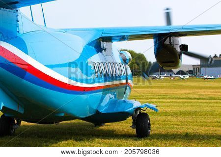 Aircraft L 410 Turbolet in flight in blue sky at sunny day in Prague, Czech Republic