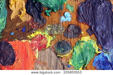 Mix Of Oil Paints On Handmade Wooden Palette.