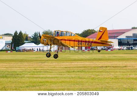 PRAGUE, CZECH REPUBLIC - 9.09.2017: One seat single engine yellow civil utility aircraft Cmelak in airport in Prague, Czech Republic