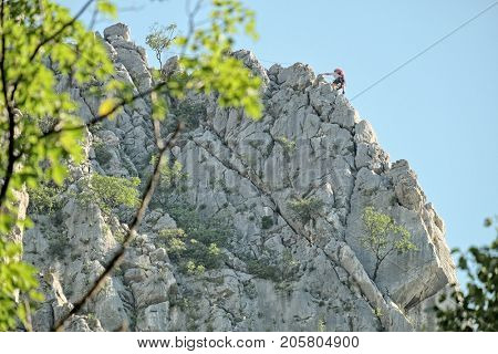 a rock climber on a rocky ridge of Vrachanski Balkan Nature Park in Vratsa, Bulgaria 