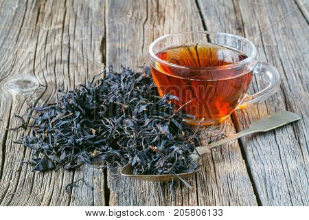 Dry Leaf Of Chenesse Tea And Glass Cup