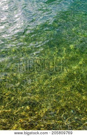Vertical up view of crystal transparent fresh river, sea water