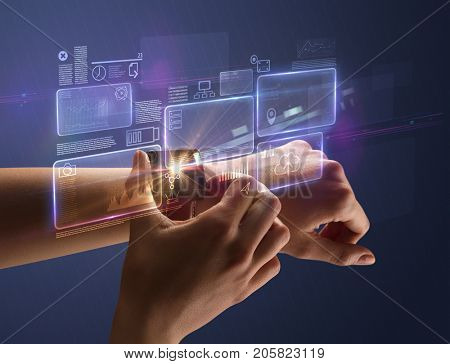 Female hand wearing smartwatch with statement labels around and dark background