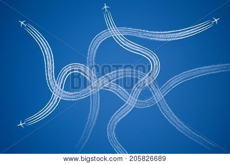 Chaotic confused stressful symbol of tangled aircraft vapor trails.