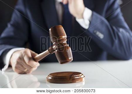 Auction and business concept.  Court executive oficer during judicial sale.