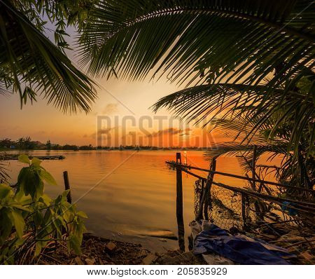 Vinh Cura Dai river in Hoi An Vietnam at sunset