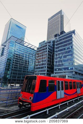 London, Canary Wharf modern skyscrapers with train