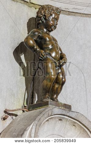 Pissing Boy statue (Manneken Pis) in Brussels Belgium - architecture background