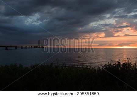 StorebÃÂ¦ltsbroen bridge. The sun is setting