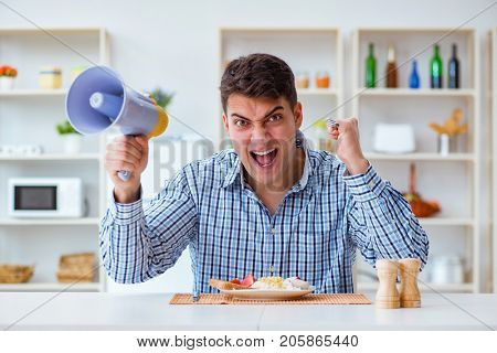 Husband with loudspeaker yelling at his wife