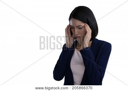Businesswoman suffering from headache against white background