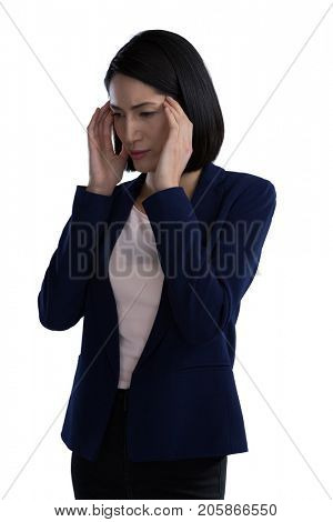 Businesswoman suffering from headache against white background