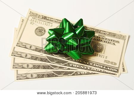 U.S currency money with a bow for a gift.
