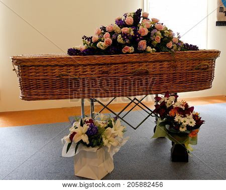 closeup shot of a colorful casket in a hearse or chapel before funeral or burial at cemetery
