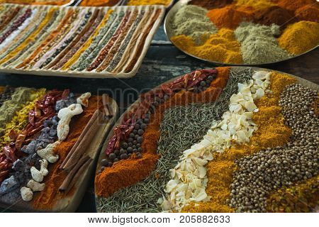 Close-up of various spices arranged in tray