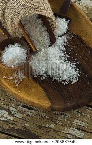 Close-up of sea slat on wooden plate