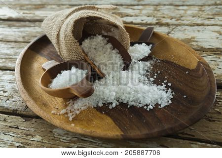 Close-up of sea slat on wooden plate