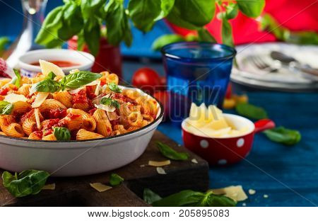 Pasta with spicy tomato sauce, parmesan and basil. Pasta Chifferi Rigati.