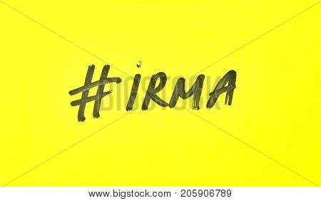 Popular hashtag irma written on a yellow paper