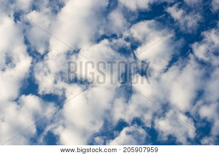 Photo of blue sky with spindrift clouds background