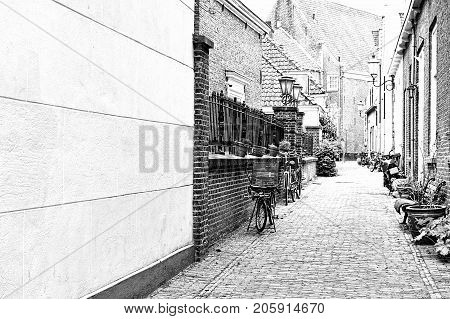 Typical Dutch brick houses in Holland. Street View with bikes parked in the historical center of Amersfoort in the Netherlands. Black and white picture