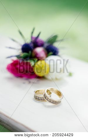 The wedding rings with flowers, marriage concept.