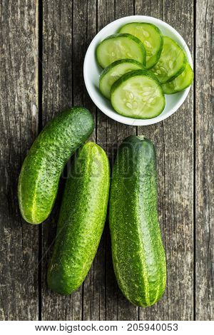 Sliced green cucumbers. Cucumbers in bowl. Top view.