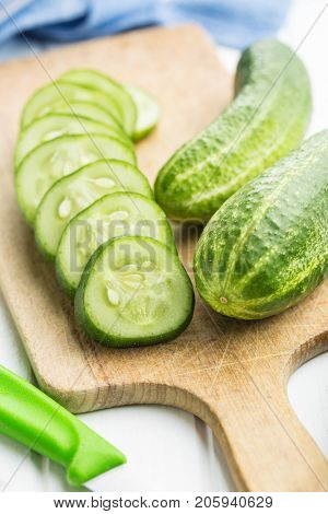 Sliced green cucumbers. Cucumbers on cutting board.