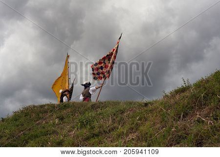 PALMANOVA ITALY - SEPTEMBER 03: Men with flags dressed in ancient clothes during the historical Reenactment a.d. 1615 on September 03 2017