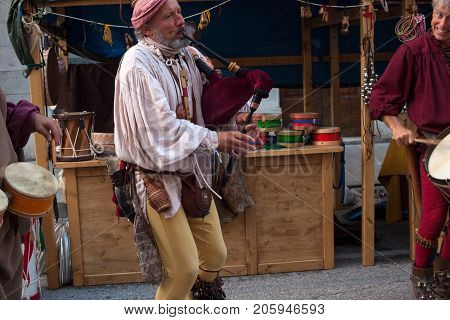 PALMANOVA ITALY - SEPTEMBER 03: Historical bagpiper and drummer dressed in ancient clothes during the historical Reenactment a.d. 1615 on September 03 2017
