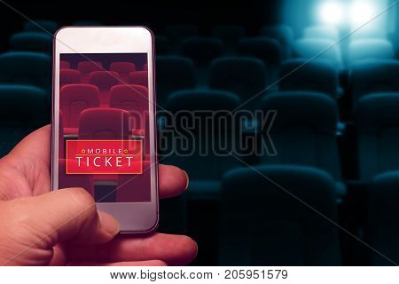 hand holding smartphone for reserved movie ticket. online ticket buying.