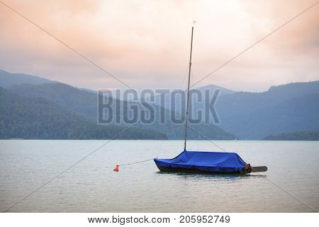 Sailboat on mountain lake. Walchensee or Lake Walchen is one of the deepest and largest alpine lakes in Germany, with a maximum depth of 192.3 metres and an area of 16.4 square kilometres.