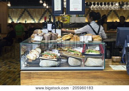 Melbourne Airport, Australia: October 11, 2015: Serving food, drinks and snacks in the departure lounge at Tullermaine airport in Melbounre. The food is very expensive when purchased flight side.