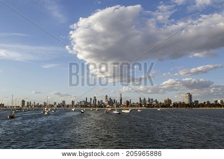 St Kilda, Australia: March 15, 2017: Sail boats moored in the bay off St Kilda Pier with the cityscape of Melbourne behind.
